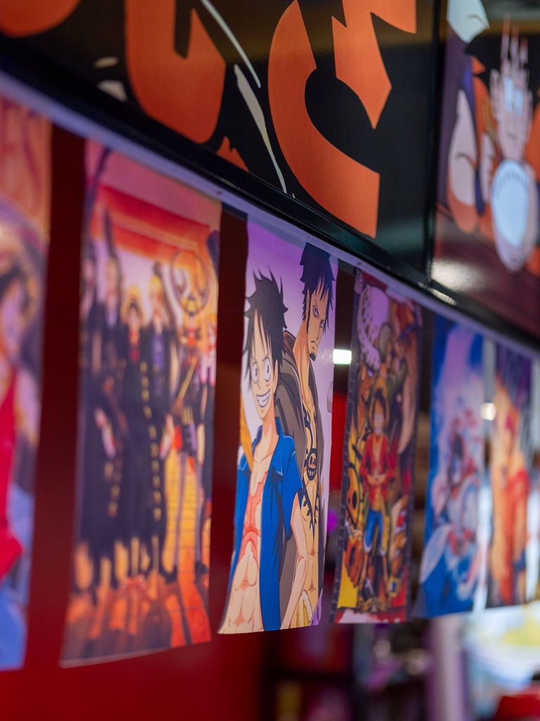 Anime banners hanging from the ceiling of the restaurant